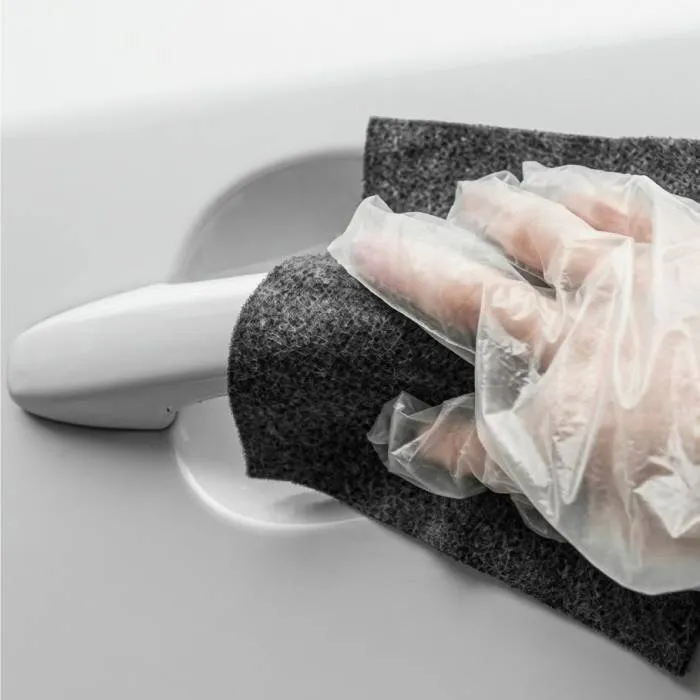 Applying NanoPolix cloth to car paint
